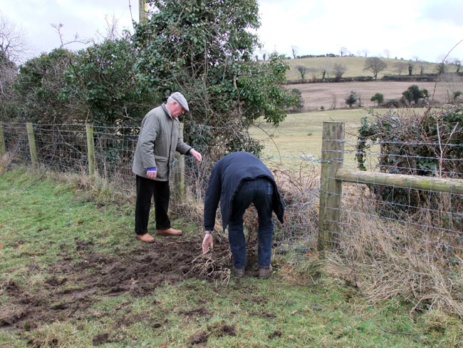 Willy Madowell gets a hand to re-fix the wire